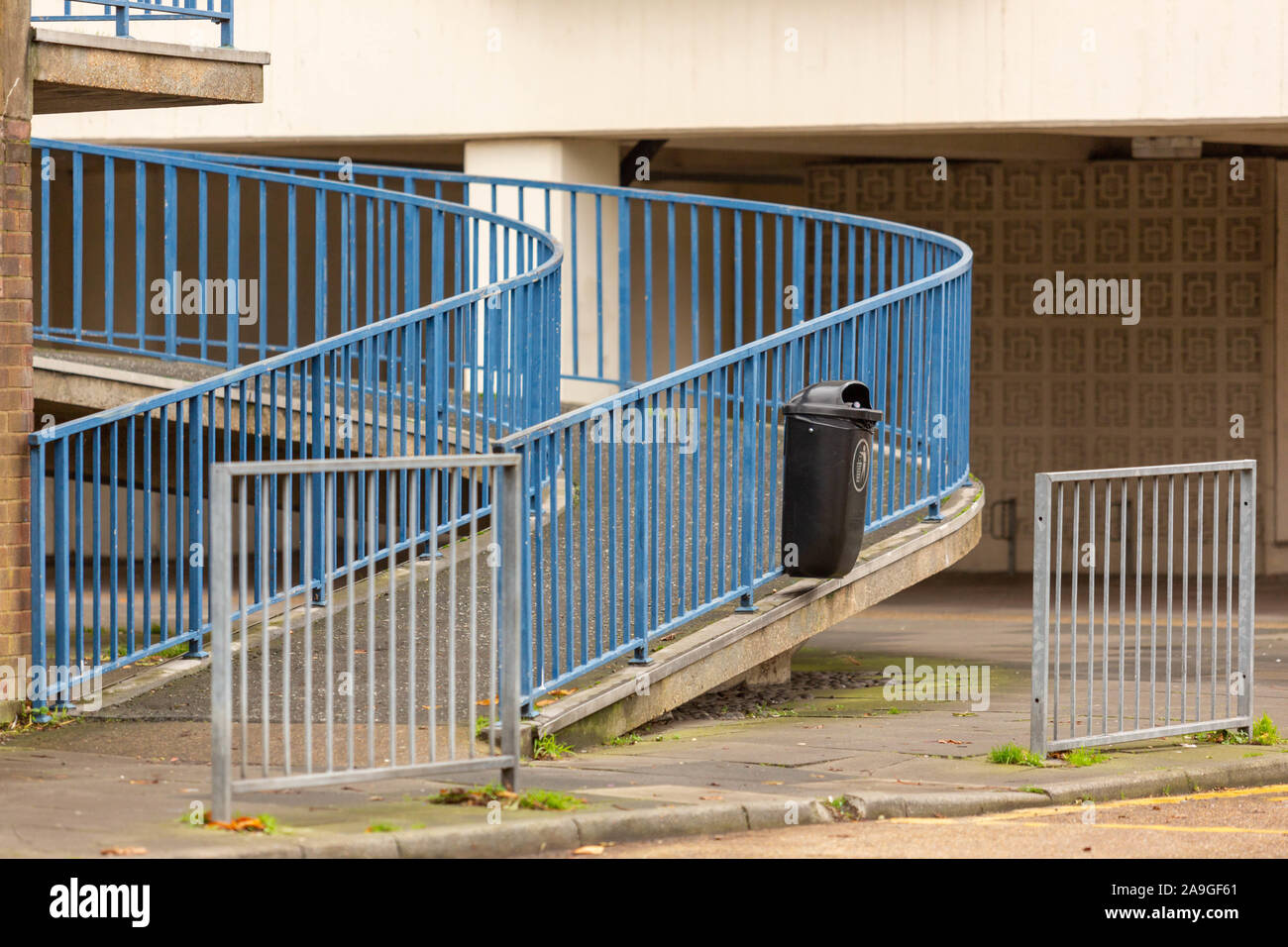 Curved ramp with blue railings at Queensway Estate, Southend-on-Sea ...