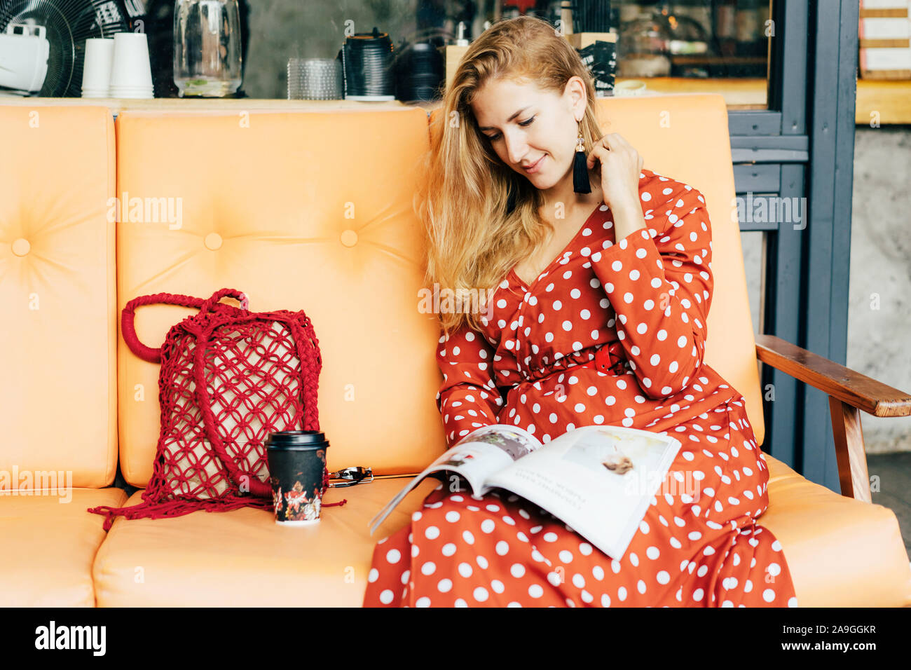 Elegant woman in a red polka-dot dress Stock Photo - Alamy
