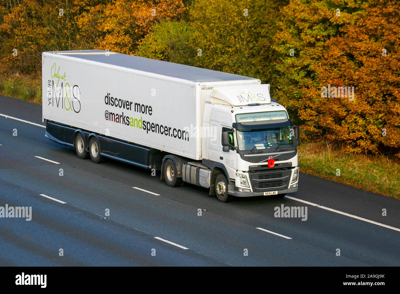 M&S Haulage delivery trucks, white lorry, transportation, truck, cargo, Volvo vehicle, delivery, commercial transport, industry, on the M61 at Chorley, UK Stock Photo