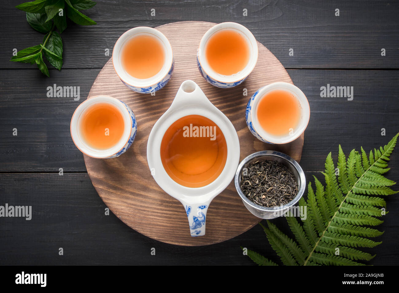 Tea chinese ceremony. Cups of green tea with mint and kettle on