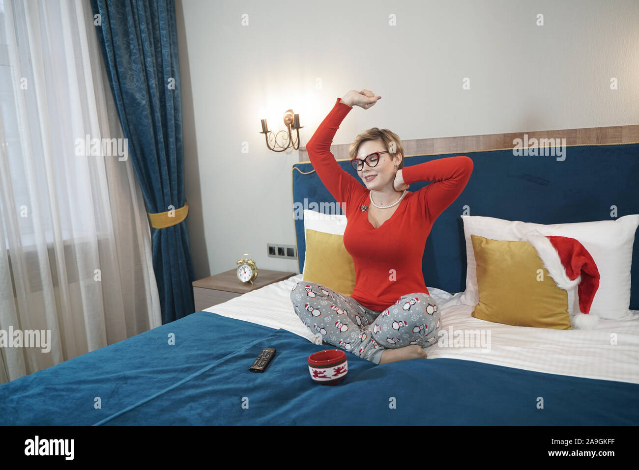 Cute Plus Size Short Hair Blonde Girl In Glasses Yawns In The