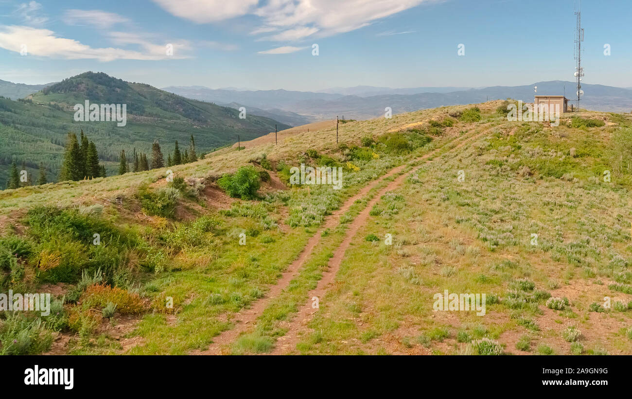 Panorama Blue sky and clouds over chairlifts and hiking trails in Park ...