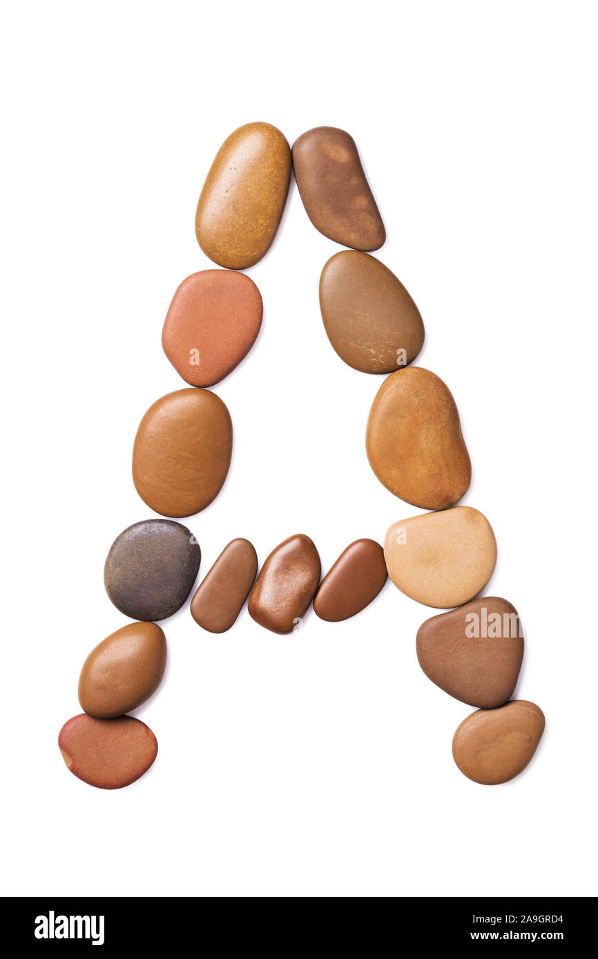 Letter A laid out of marine small pebbles, top view Stock Photo