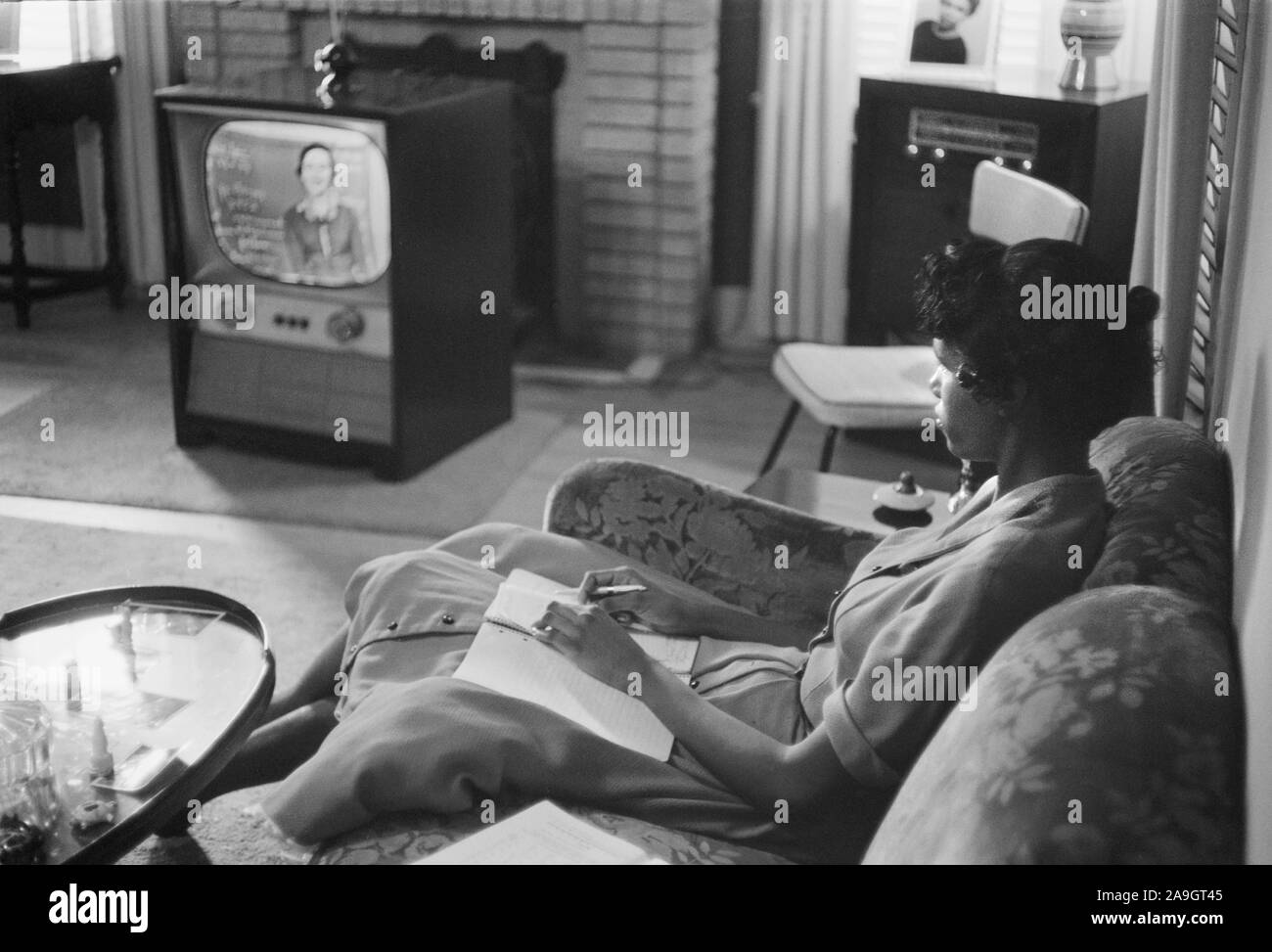 African-American High School Girl being Educated via Television during period that Schools were Closed to Avoid Integration, Little Rock, Arkansas, USA, photograph by Thomas J. O'Halloran, September 1958 Stock Photo