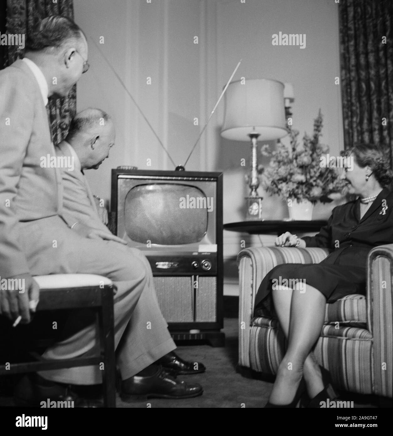 Dwight and Mamie Eisenhower watching a television during the Republican National Convention, Chicago, Illinois, USA, Photograph by Thomas J. Halloran, July 1952 Stock Photo