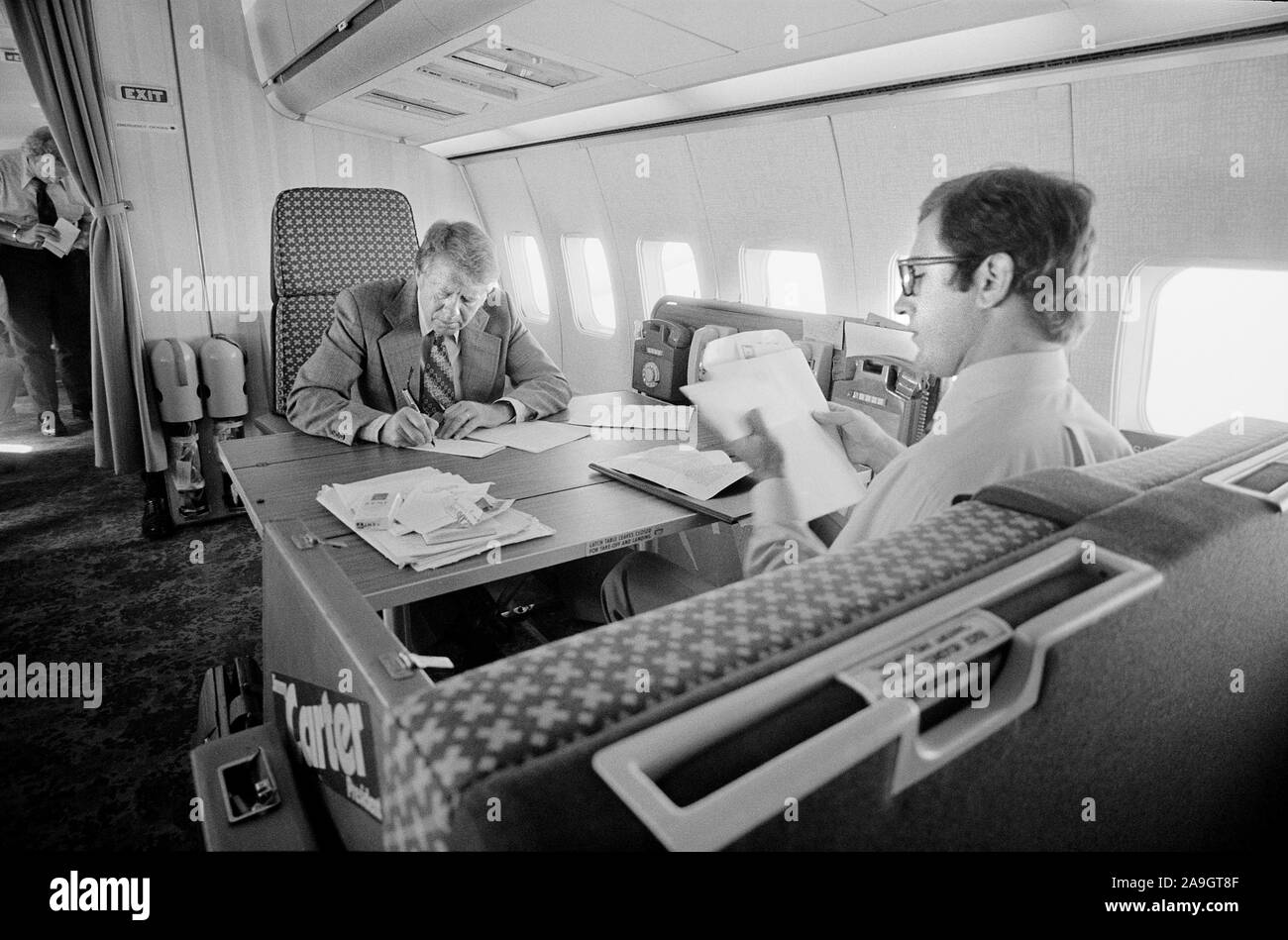 Democratic Presidential Nominee Jimmy Carter and his Chief Speechwriter, Pat Anderson, Working aboard the 'Peanut One' Campaign Airplane, photograph by Thomas J. O'Halloran, September 13, 1976 Stock Photo