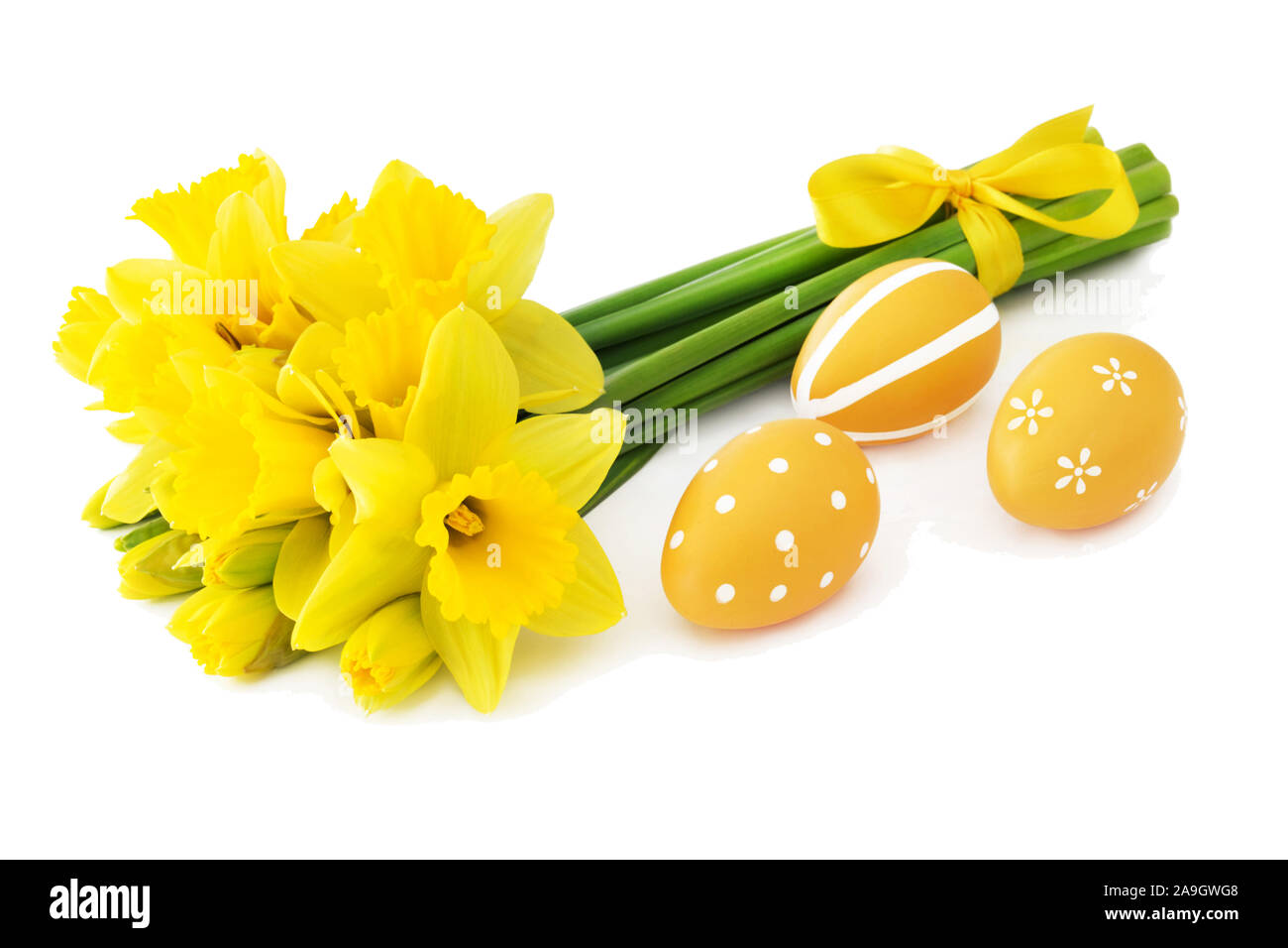 Daffodils and yellow Easter eggs Stock Photo