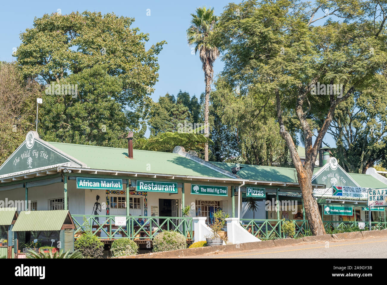 SABIE, SOUTH AFRICA - MAY 21, 2019: A street scene, with the Wild Fig Tree shopping centre, in Sabie Stock Photo