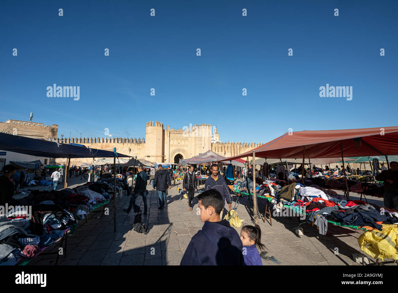 Fez, Morocco. November 9, 2019.  the stands of clothing vendors in the large Place Boujloud Stock Photo