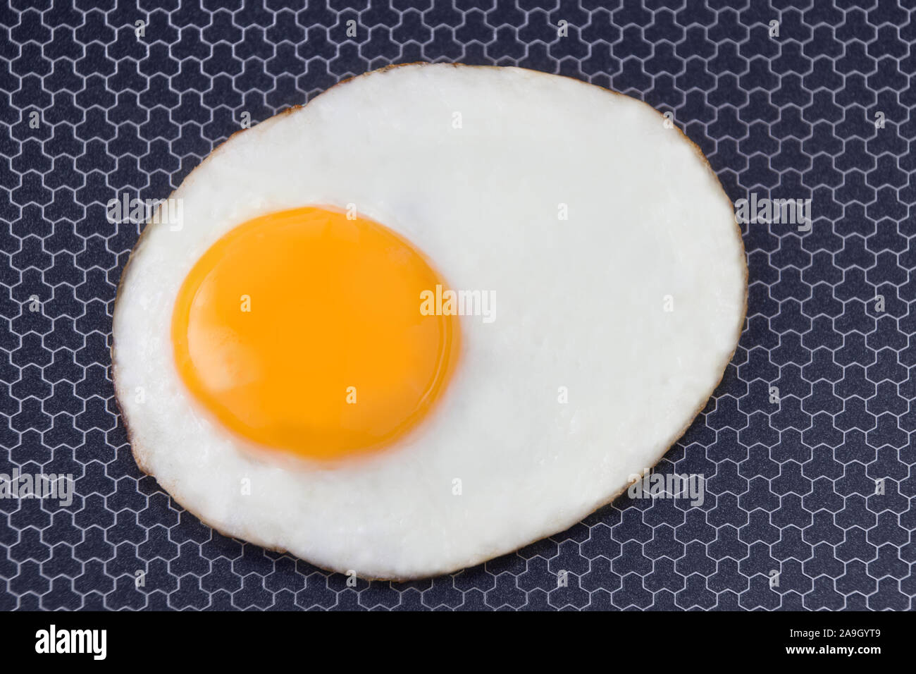 Fried egg in a nonstick pan Stock Photo Alamy