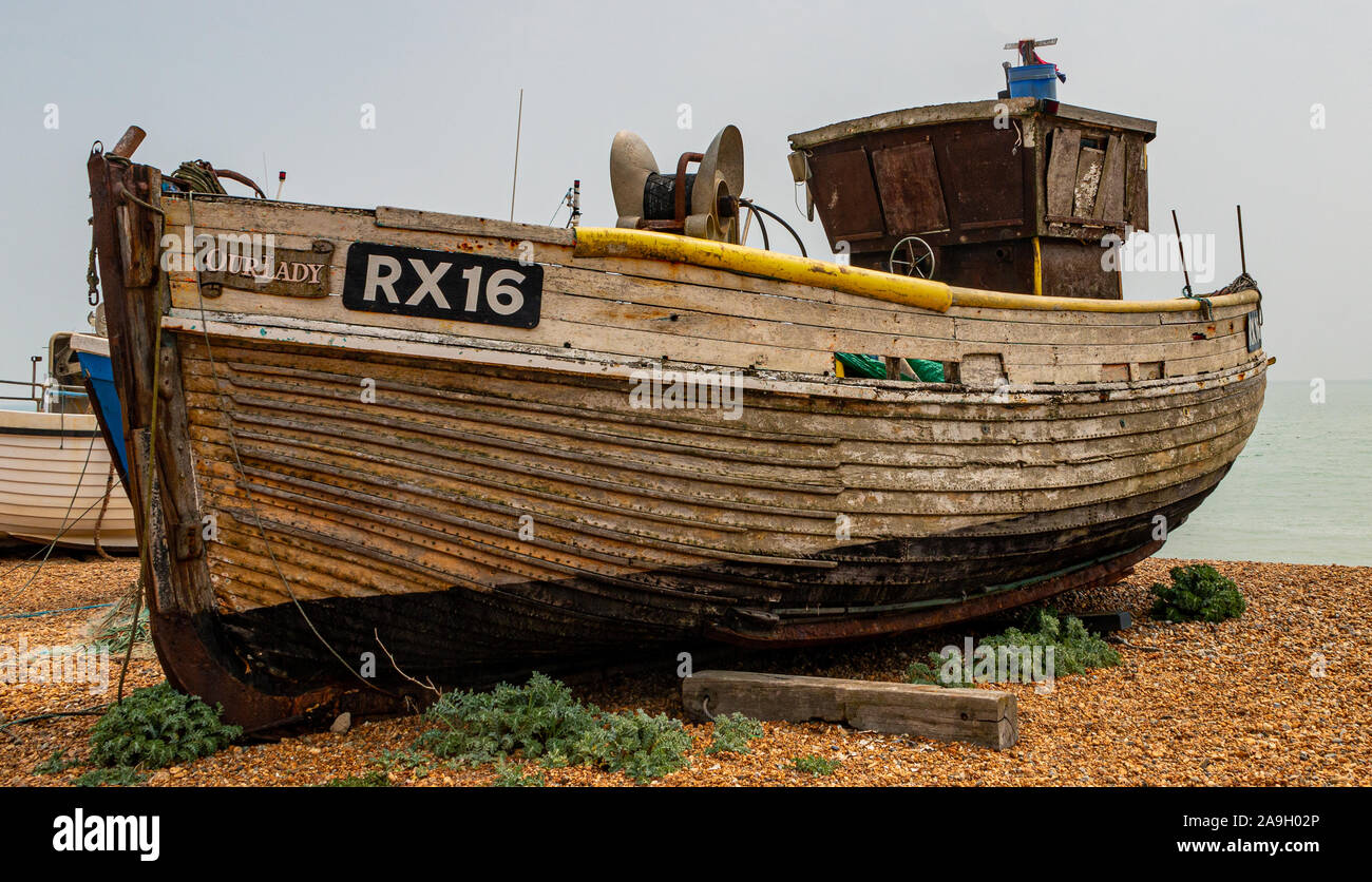 Old fishing boat on the beach Stock Photo - Alamy
