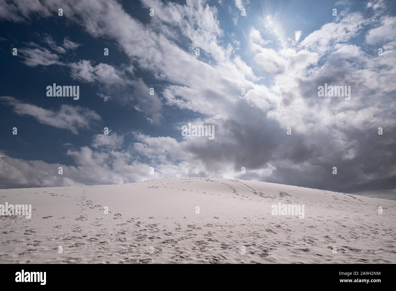 scenic view of white sand dunes against cloud sky in New Mexico USA Stock Photo