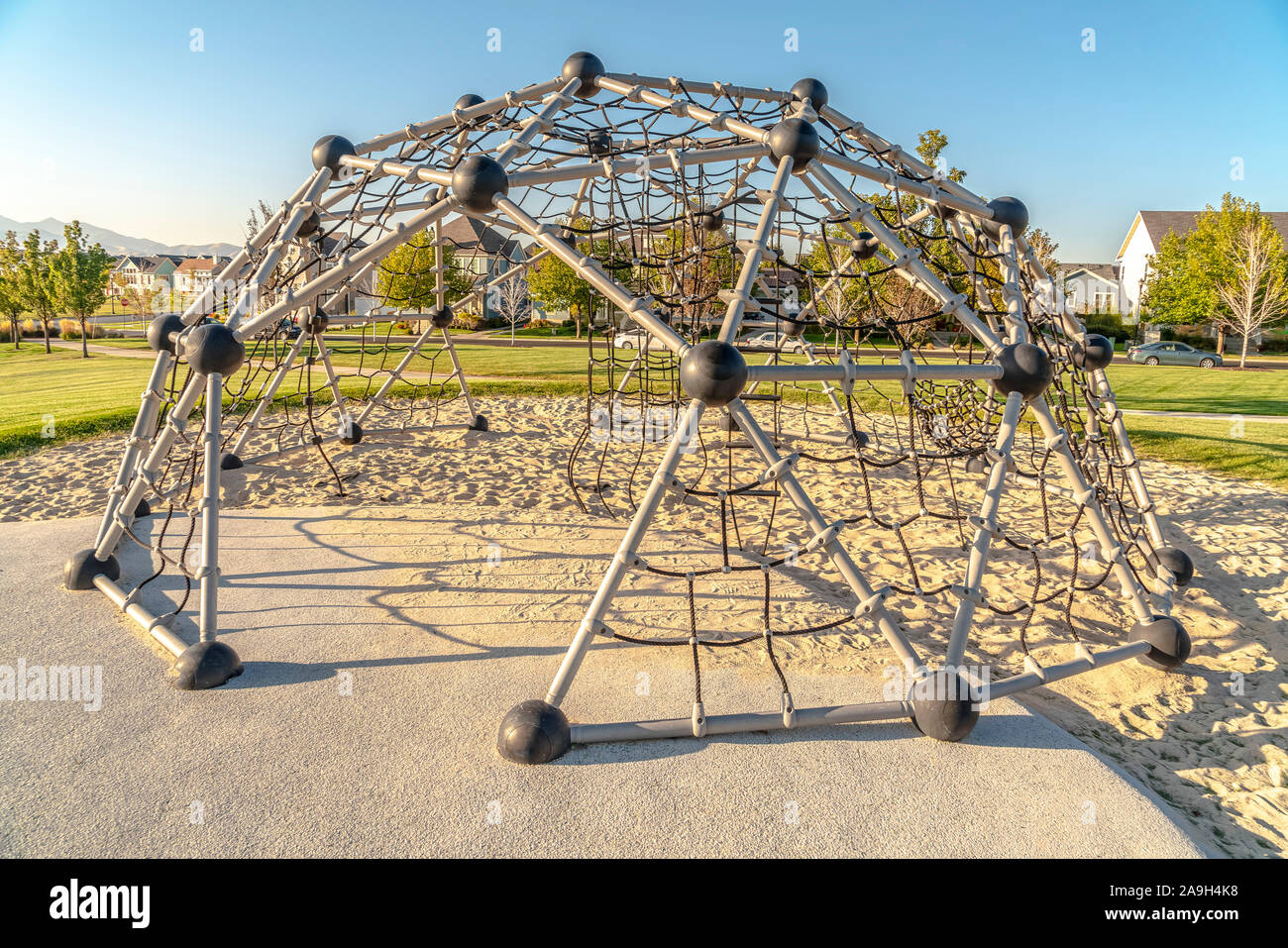 Urban climbing dome with nets in a kids playground Stock Photo Alamy
