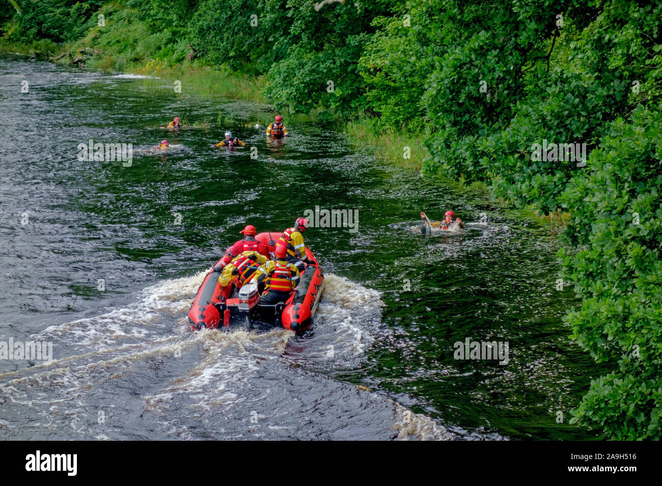 Scottish Fire and Rescue personnel on a water rescue training exercise in the River Cree at Newton Stewart, Dumfries and Galloway, Scotland. Stock Photo