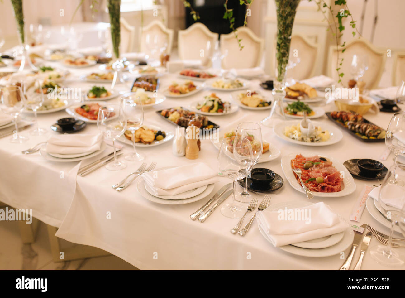 Table with mixed food. Banquet in restaurant, table setting. Differend ...