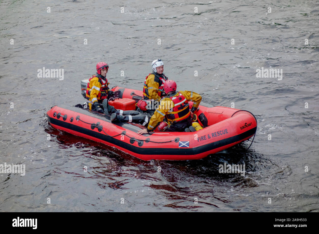 Scottish Fire and Rescue personnel on a water rescue training exercise in the River Cree at Newton Stewart, Dumfries and Galloway, Scotland. Stock Photo