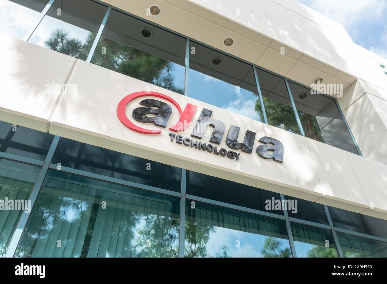 Facade with sign and logo at United States regional headquarters of Chinese surveillance products company Dahua Technologies, Irvine, California, October 27, 2019. () Stock Photo