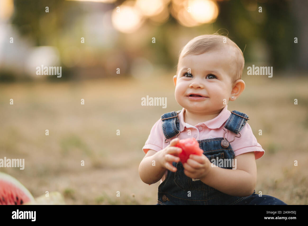 Close Up Of Adorable Baby Girl Eat Watermelon Stylish Baby In