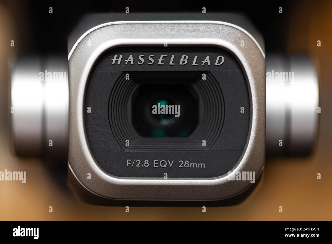 A close up of a Hasselblad camera on a DJI Mavic 2 Pro drone with a shallow depth of field. This large sensor produces beautiful aerial photos. Stock Photo