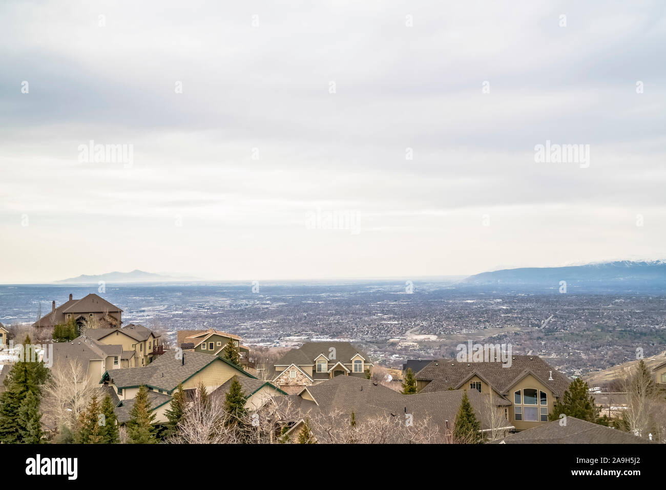 Aerial view of houses in the valley with mountain and horizon in the ...