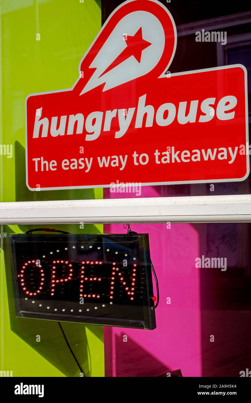 Hungryhouse sign in the window of a food takeaway in Girvan, Ayrshire, Scotland. Stock Photo