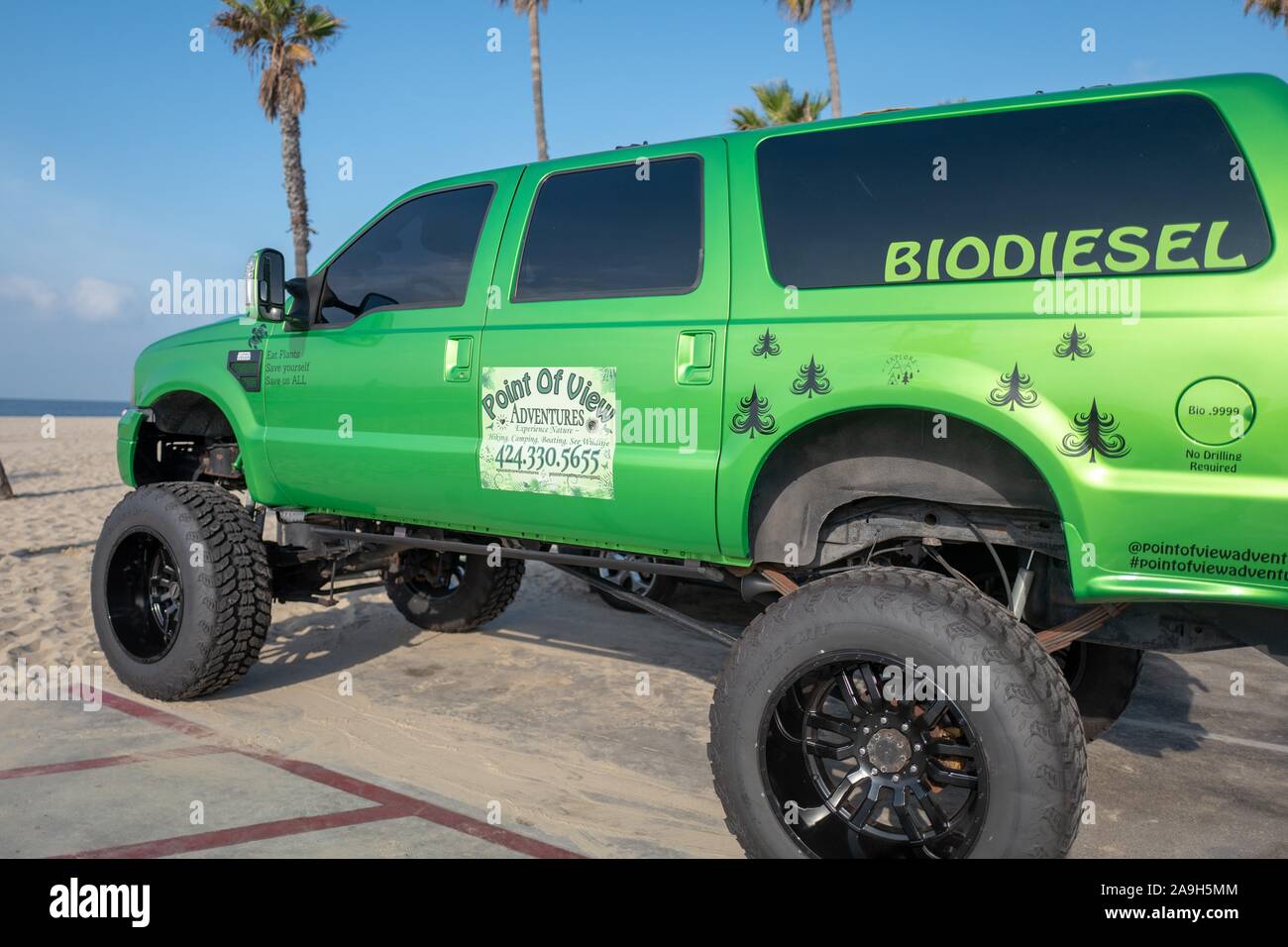 Large monster truck style vehicle in green color, with text reading Biodiesel, advertising the benefits of plant derived biodiesel fuel, Venice, Los Angeles, California, November 5, 2019. () Stock Photo