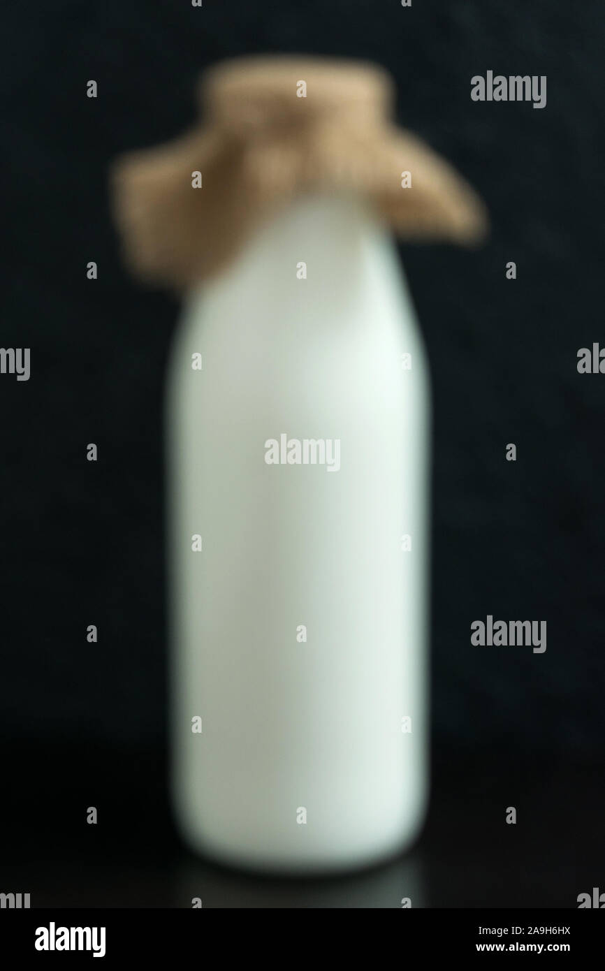 Blurred background from a bottle of milk, for lettering text. Stock Photo