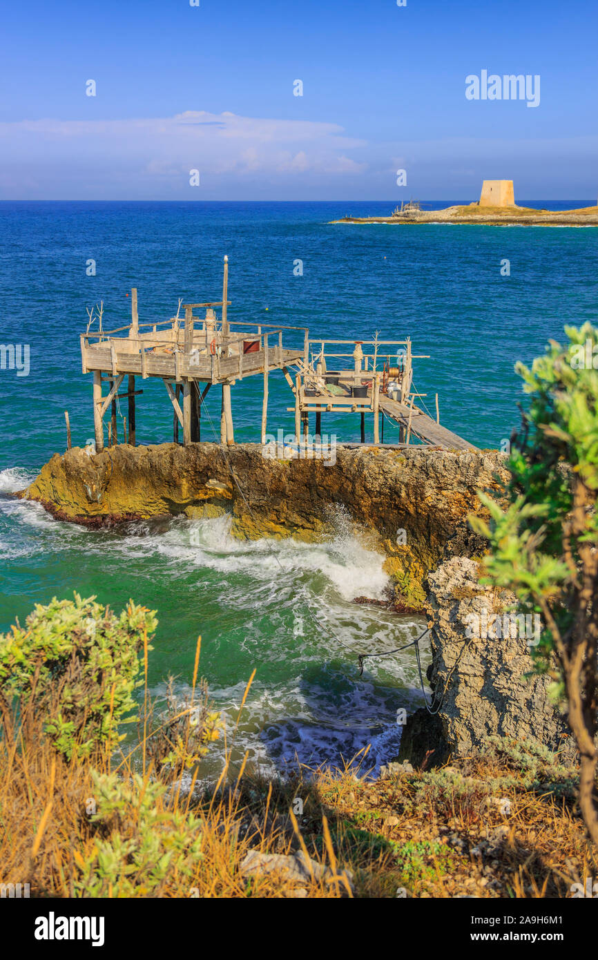 Apulia sea: the trebuchet. The characteristic 'trabucco' is the background for long strolls by the sea of Gargano promontory in southern Italy. Stock Photo