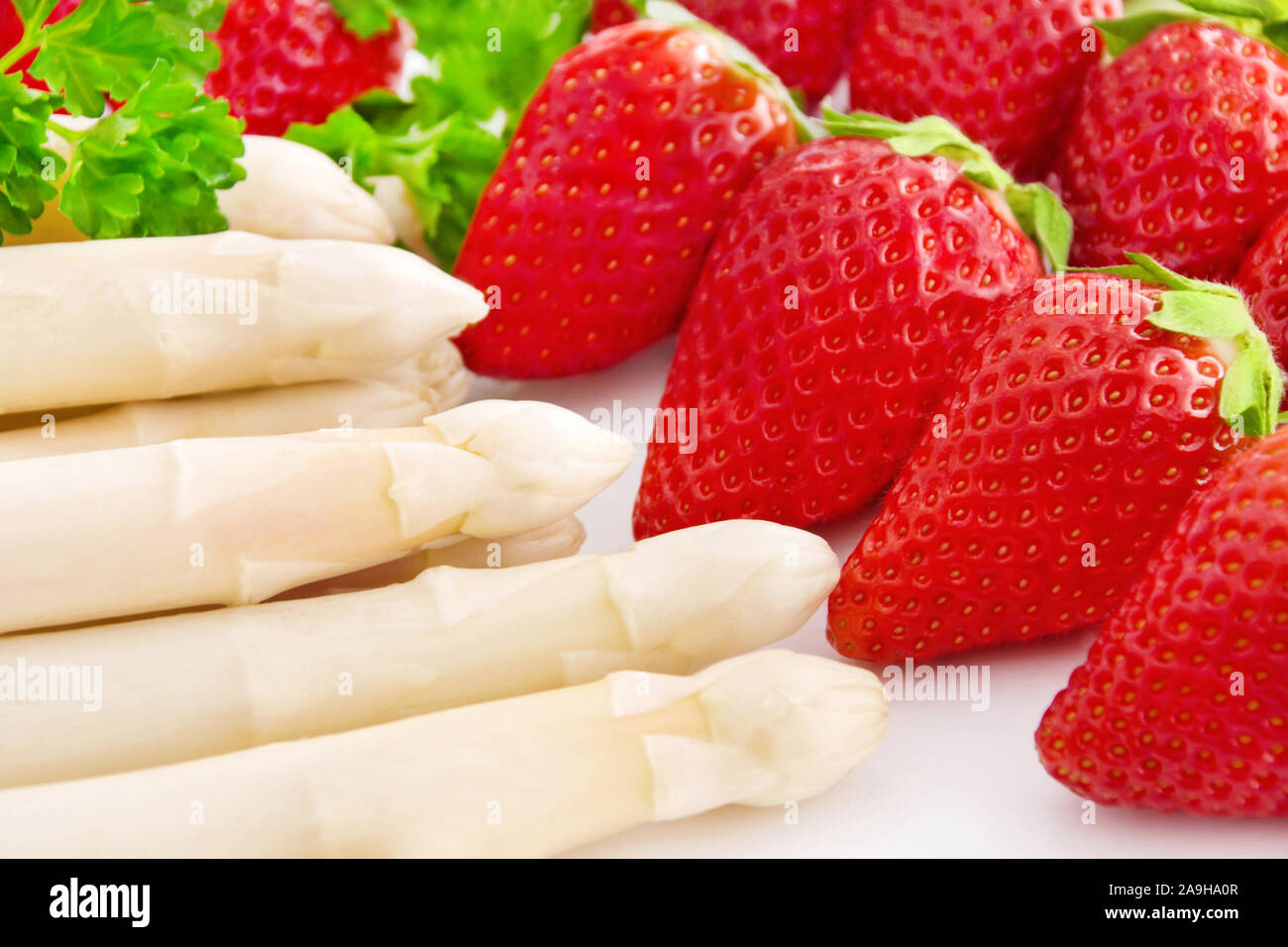 Asparagus and strawberries close up Stock Photo