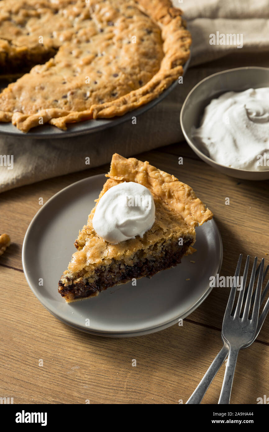 Homemade Chocolate Walnut Derby Pie with Whipped Cream Stock Photo