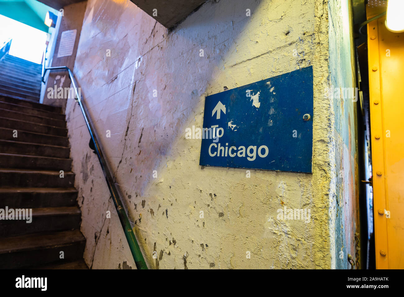 A sign pointing up a set of stairs towards Chicago. Stock Photo