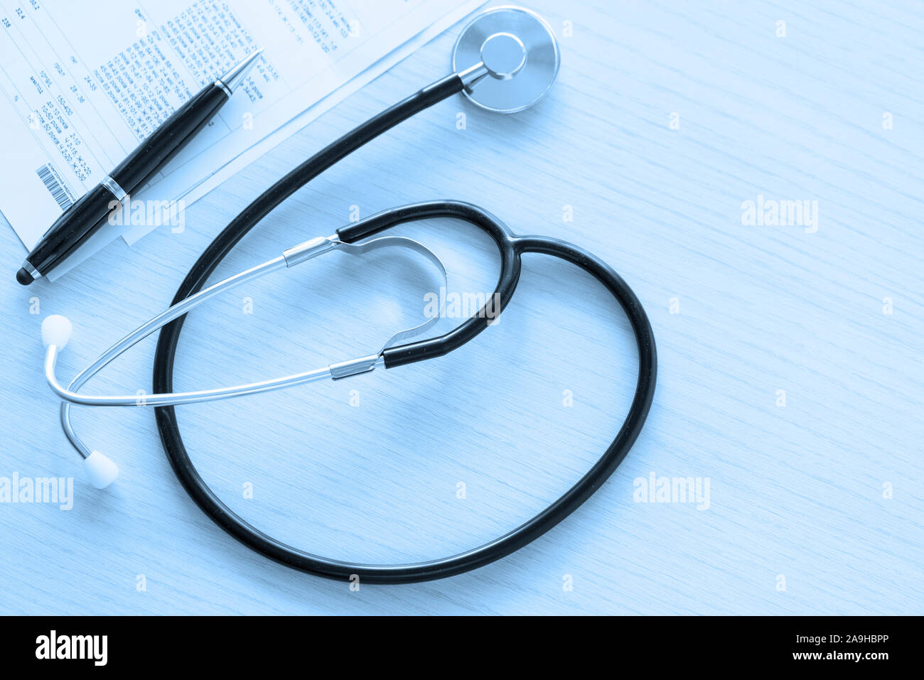 Black stethoscope on the table on blue background, top view and close up. Near is a pen and medical papers Stock Photo - Alamy Black stethoscope on the table on blue background, top view and close up. Near is a pen and medical papers Stock Photo - Alamy