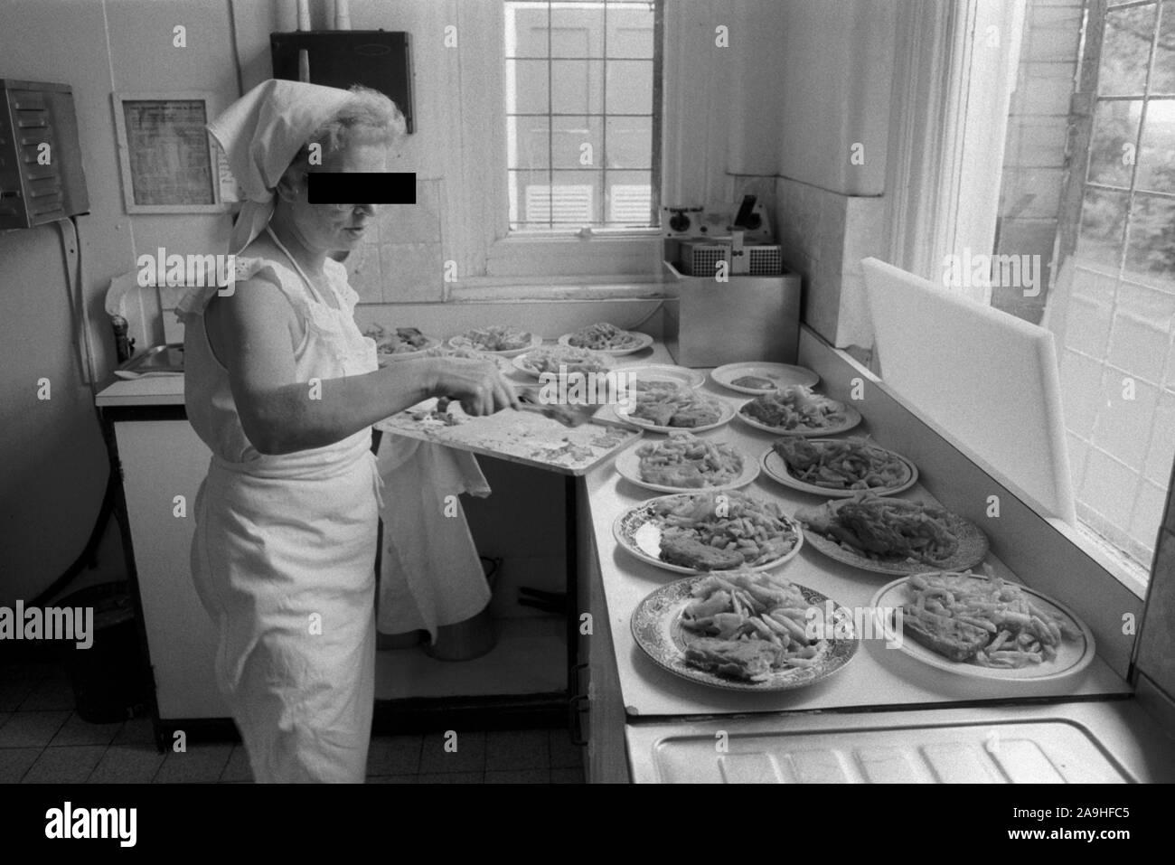 HM Prison Styal Wilmslow Cheshire UK 1980s. Womens prison,female prisoner cooking lunch for her wing inmates.  Cheshire 1986 England HOMER SYKES Stock Photo