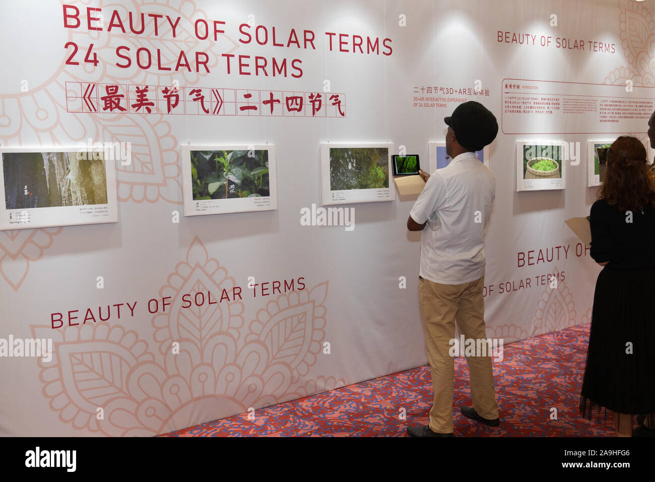 Lusaka, Zambia. 14th Nov, 2019. A local artist views a 3D AR interactive display of 24 solar terms during the 'Meet China Digital Media Arts Exhibition' in Lusaka, Zambia, on Nov. 14, 2019. China and Zambia on Thursday held a digital exhibition to showcase Chinese culture to the Zambian audience. The 'Meet China Digital Media Arts Exhibition' is the culmination of the China-Zambia Culture Year 2019. Credit: Peng Lijun/Xinhua/Alamy Live News Stock Photo