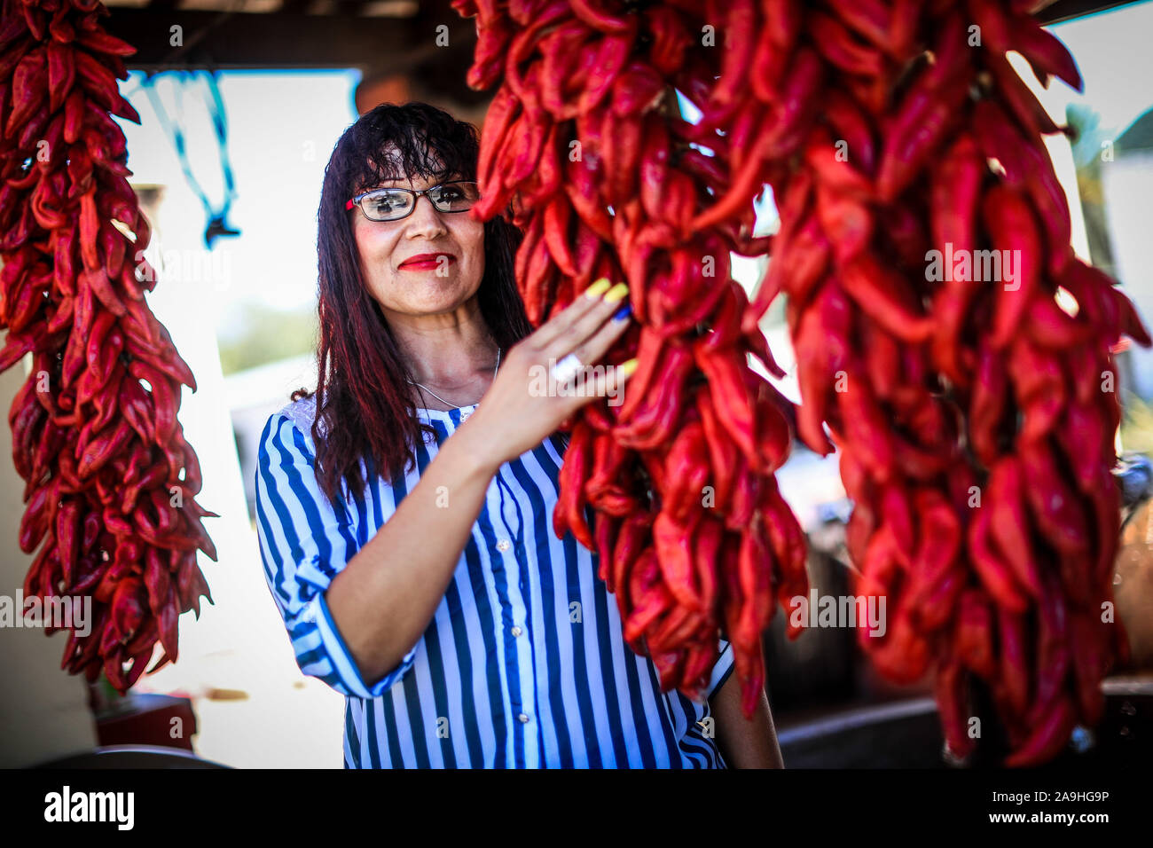 Ristras of red chile in the town Mazocahui, is part of the route of the Sonora River, Mexico. Gastronomy and Sonoran tradition. food, vegetables, red, Stock Photo