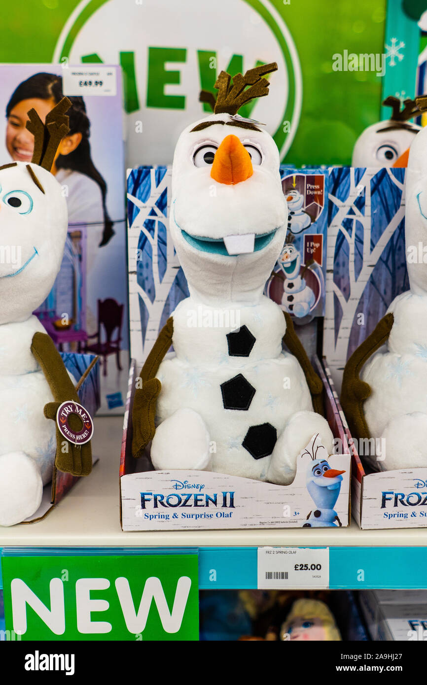 Olaf from film Frozen, teddy figures on sale ready for Christmas, fillers and little presents to go under the christmas tree Stock Photo - Alamy