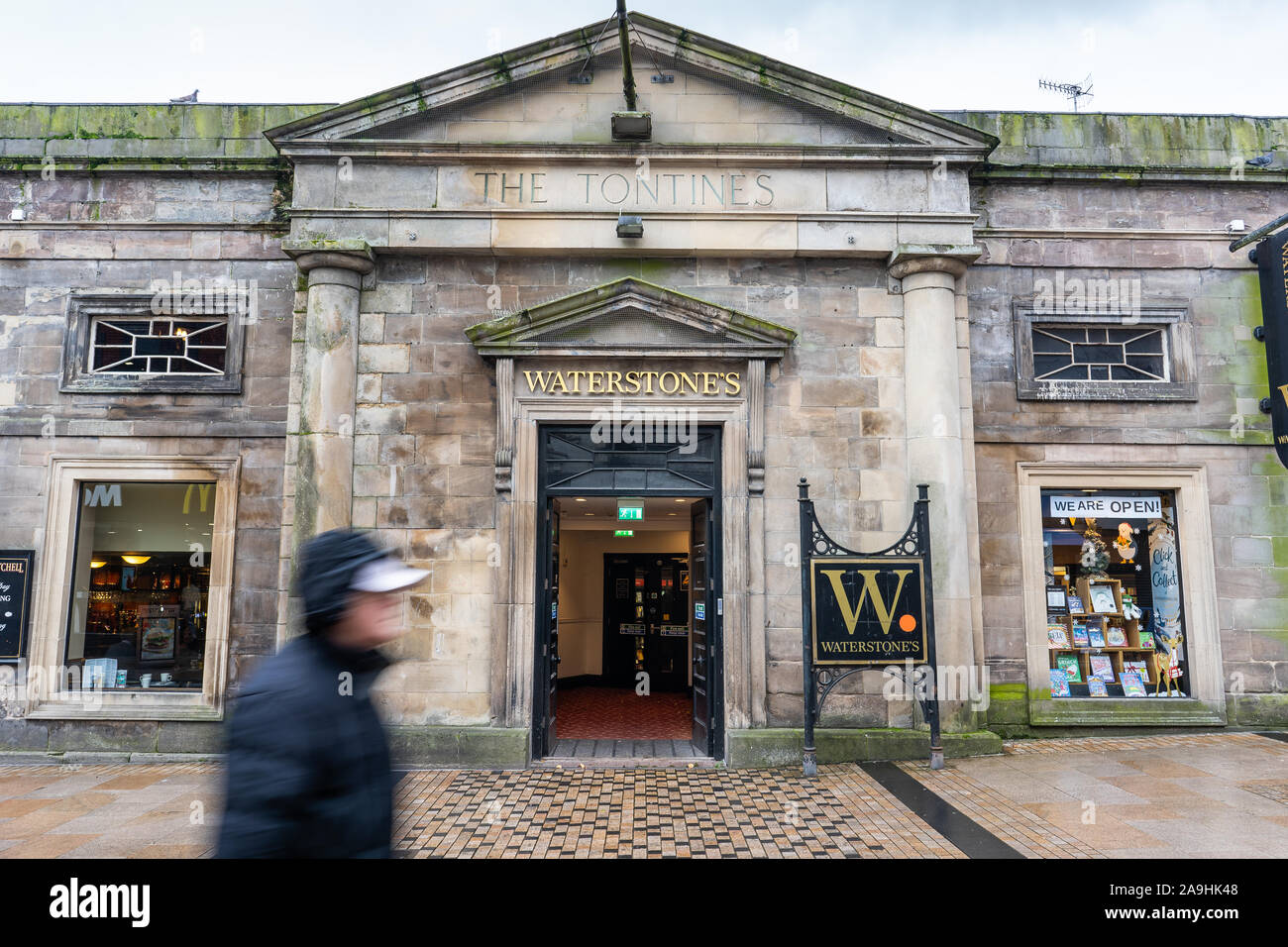 People, shoppers walk past Waterstones the mainstream and academic book retailer that encourages browsing, Waterstones Booksellers Ltd, Café W brand Stock Photo