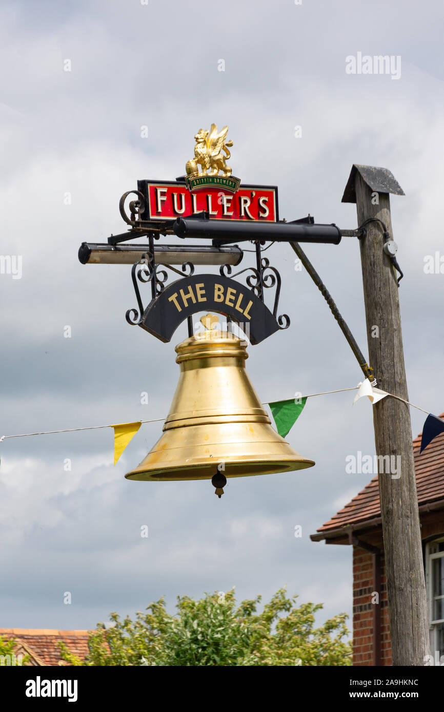 16th century thatched 'The Bell' Pub sign, The Green, Chearsley, Buckinghamshire, England, United Kingdom Stock Photo