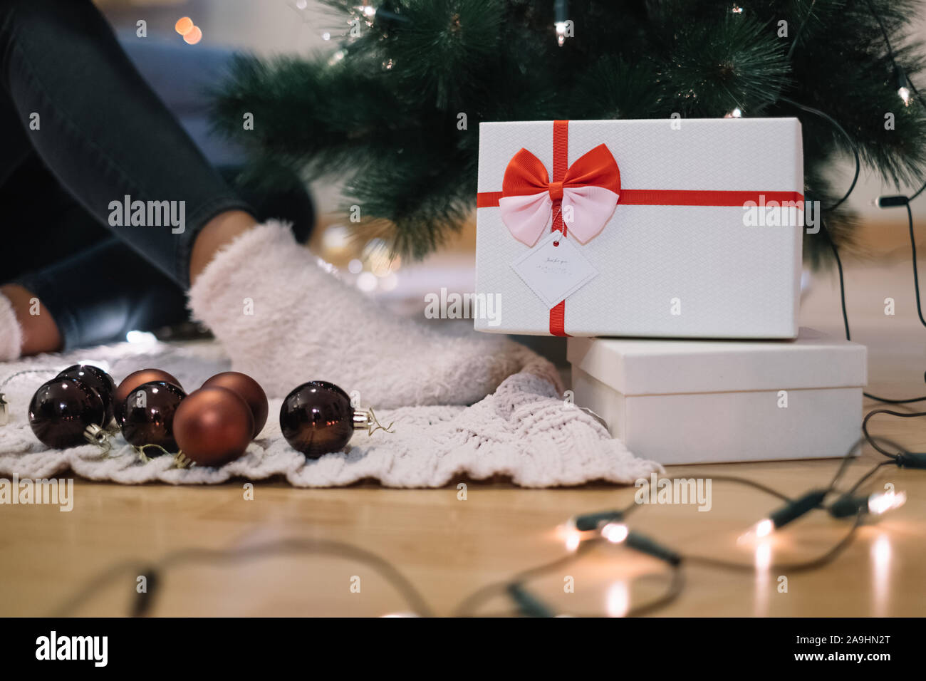 Christmas ornaments and lights with gift boxes Stock Photo