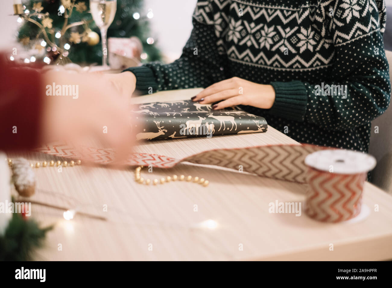 Cropped photo of woman packing Christmas presents Stock Photo