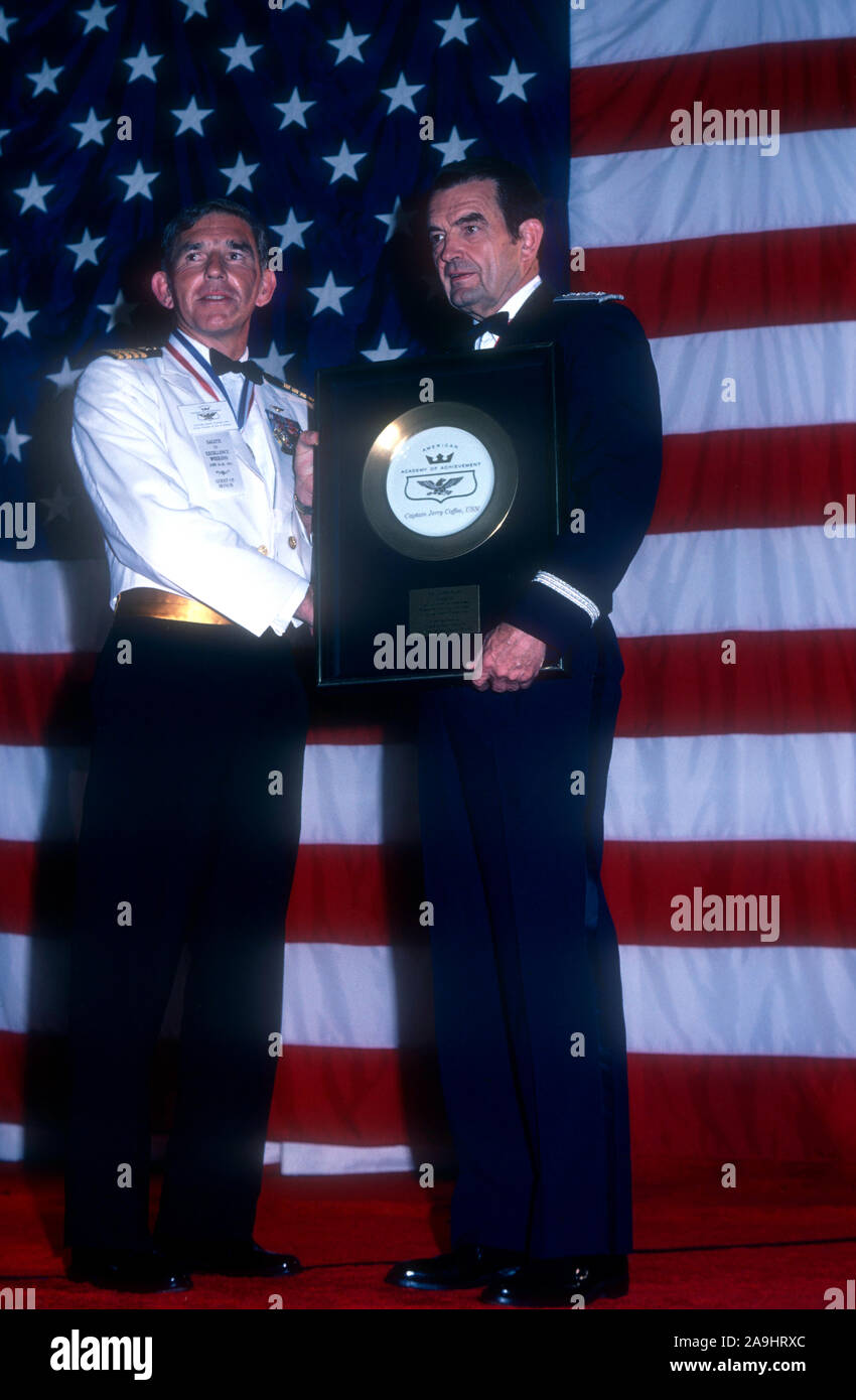 NEW ORLEANS, LA - JUNE 24: Captain Gerald L. Coffee, USN receives a golden  plate from General David Jones for "Heroic Prisoner of War" during the 1982 Academy  of Achievement Golden Plate