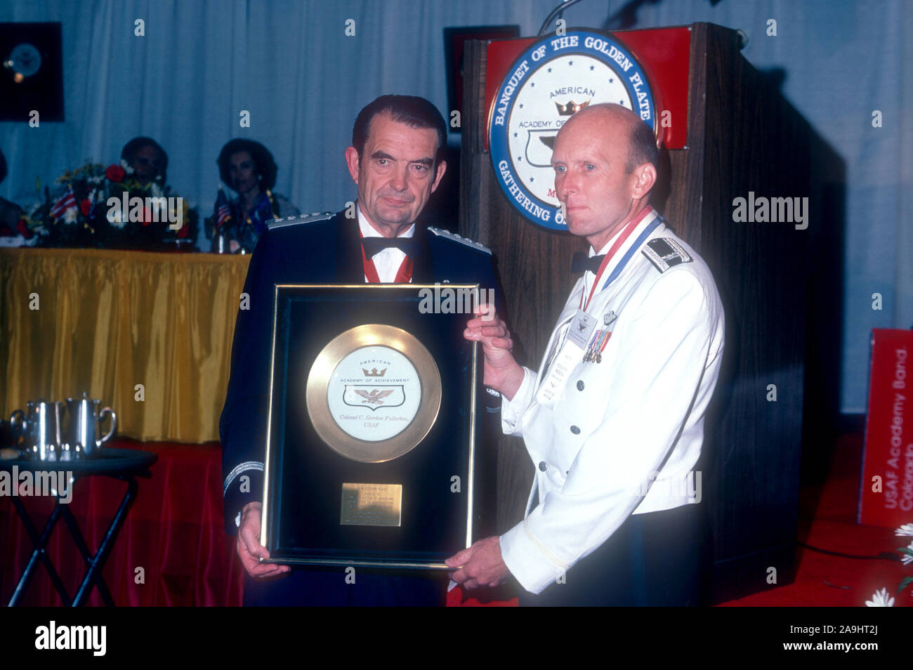 NEW ORLEANS, LA - JUNE 24: Colonel C. Gordon Fullerton, USAF receives a  golden plate from General David Jones for "Astronaut Hall of Fame" during  the 1982 Academy of Achievement Golden Plate