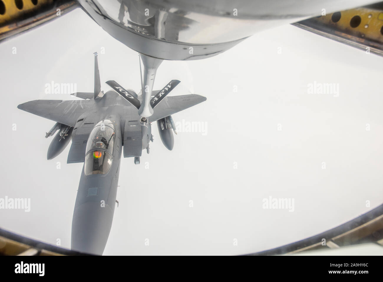An F-15E Strike Eagle assigned to the 492nd Fighter Squadron at RAF Lakenheath, England, receives fuel from a KC-135 Stratotanker assigned to the 351st Air Refueling Squadron at RAF Mildenhall, England, Nov. 14, 2019. The aircraft were participating in Exercise Point Blank. (U.S. Air Force photo by Airman 1st Class Joseph Barron) Stock Photo