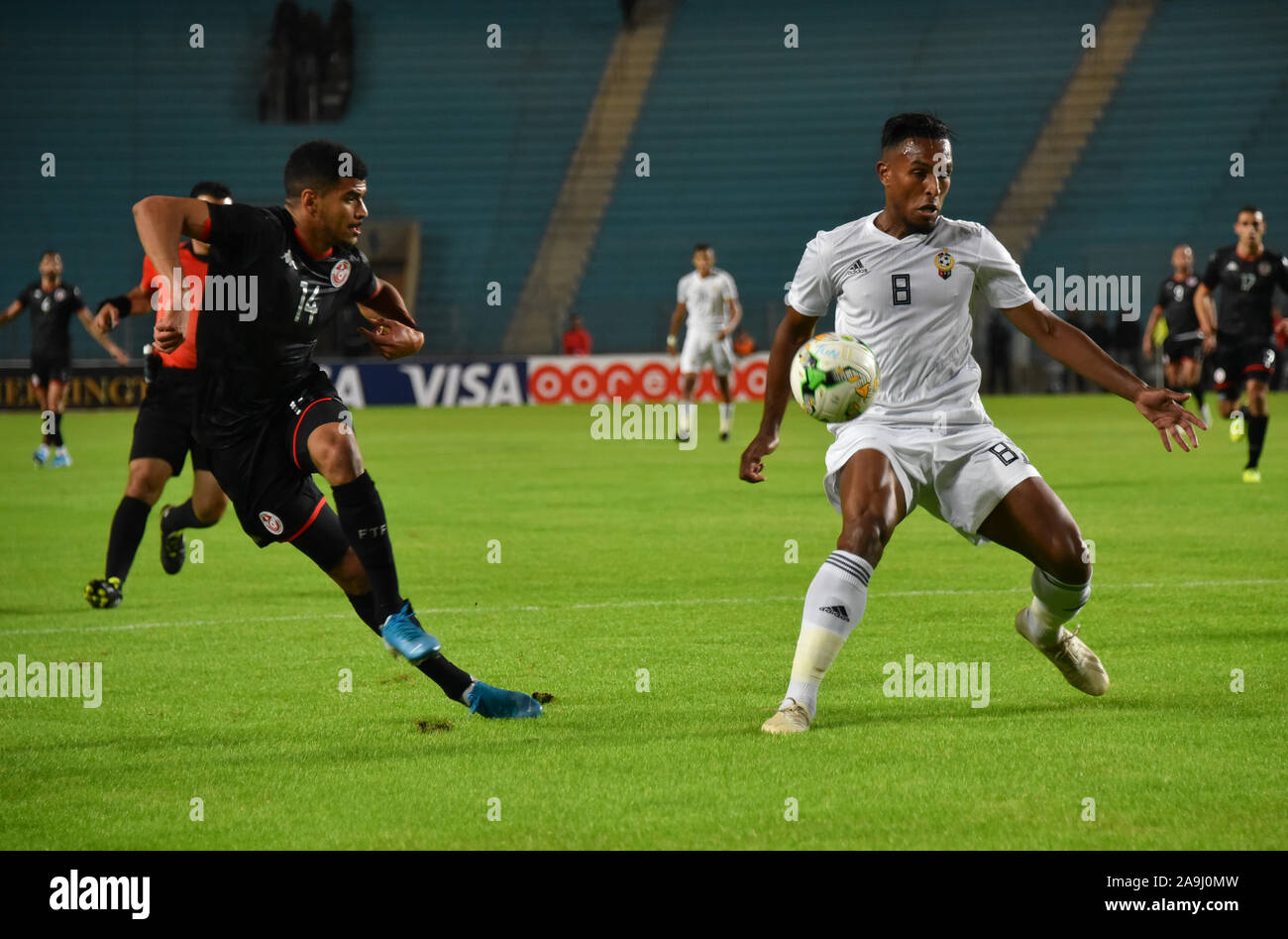 Tunis, Tunisia. 15th Nov, 2019. Tunisia's forward Mohamed Grager and Libya's defender Neji Draa are seen in action during the 2021 Africa Cup of Nations group J qualifying football match between Tunisia and Libya at the Stade Olympique de Rades.(Final score; Tunisia 4:1 Libya) Credit: SOPA Images Limited/Alamy Live News Stock Photo