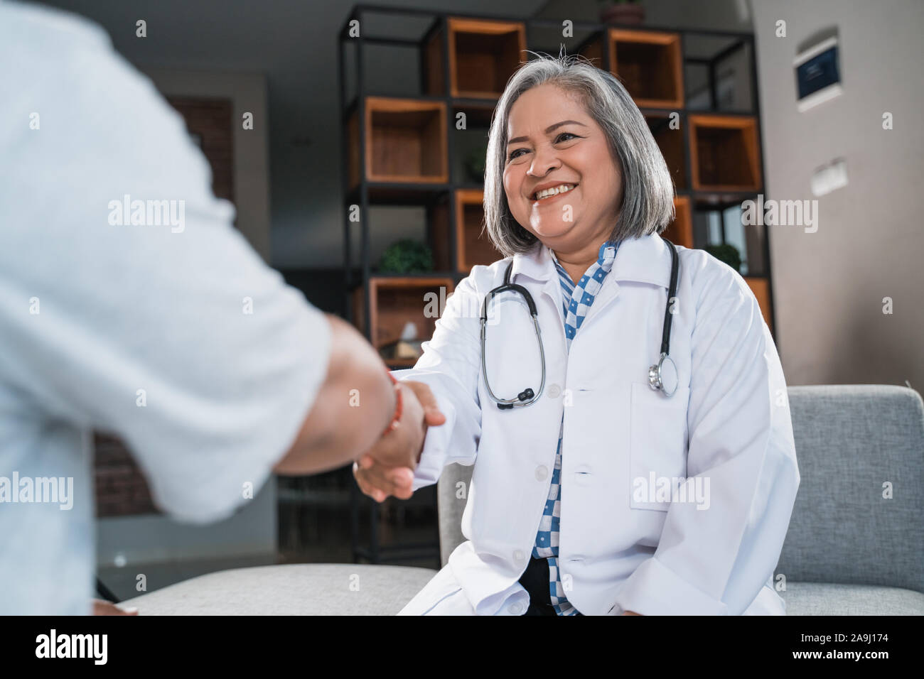 Asian female doctor speaking hi-res stock photography and images - Alamy