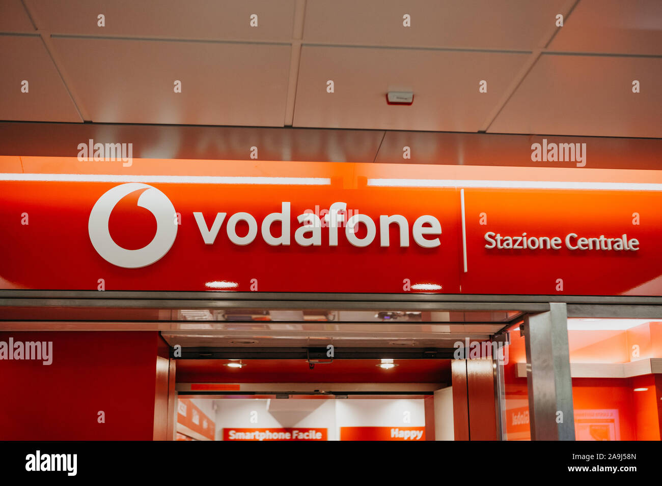 Italy, Milan, July 12, 2019: A sign Vodafon at the entrance to a retail chain store in Italy. Stock Photo