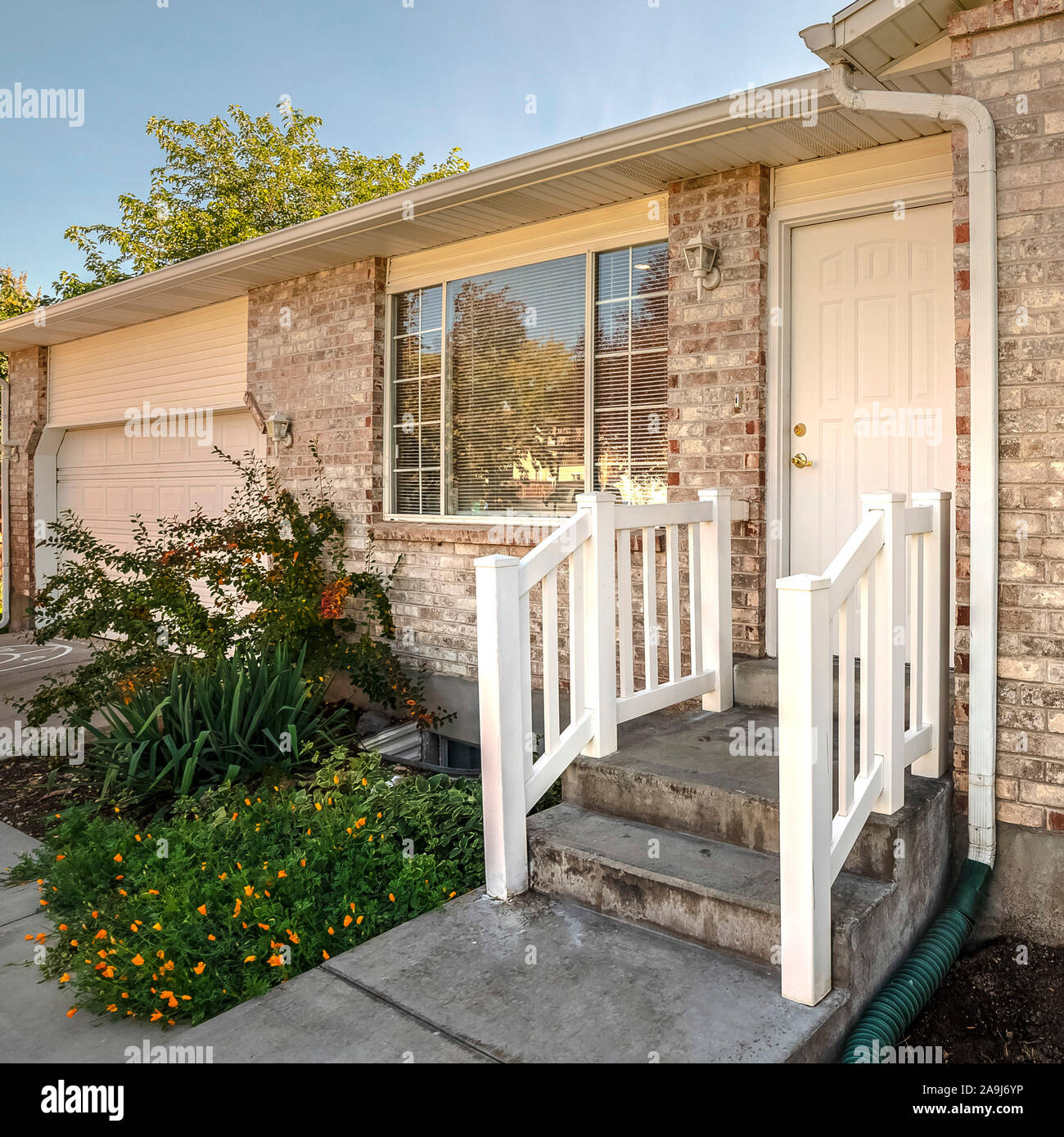 Square White wooden railing leading to a front door Stock Photo - Alamy