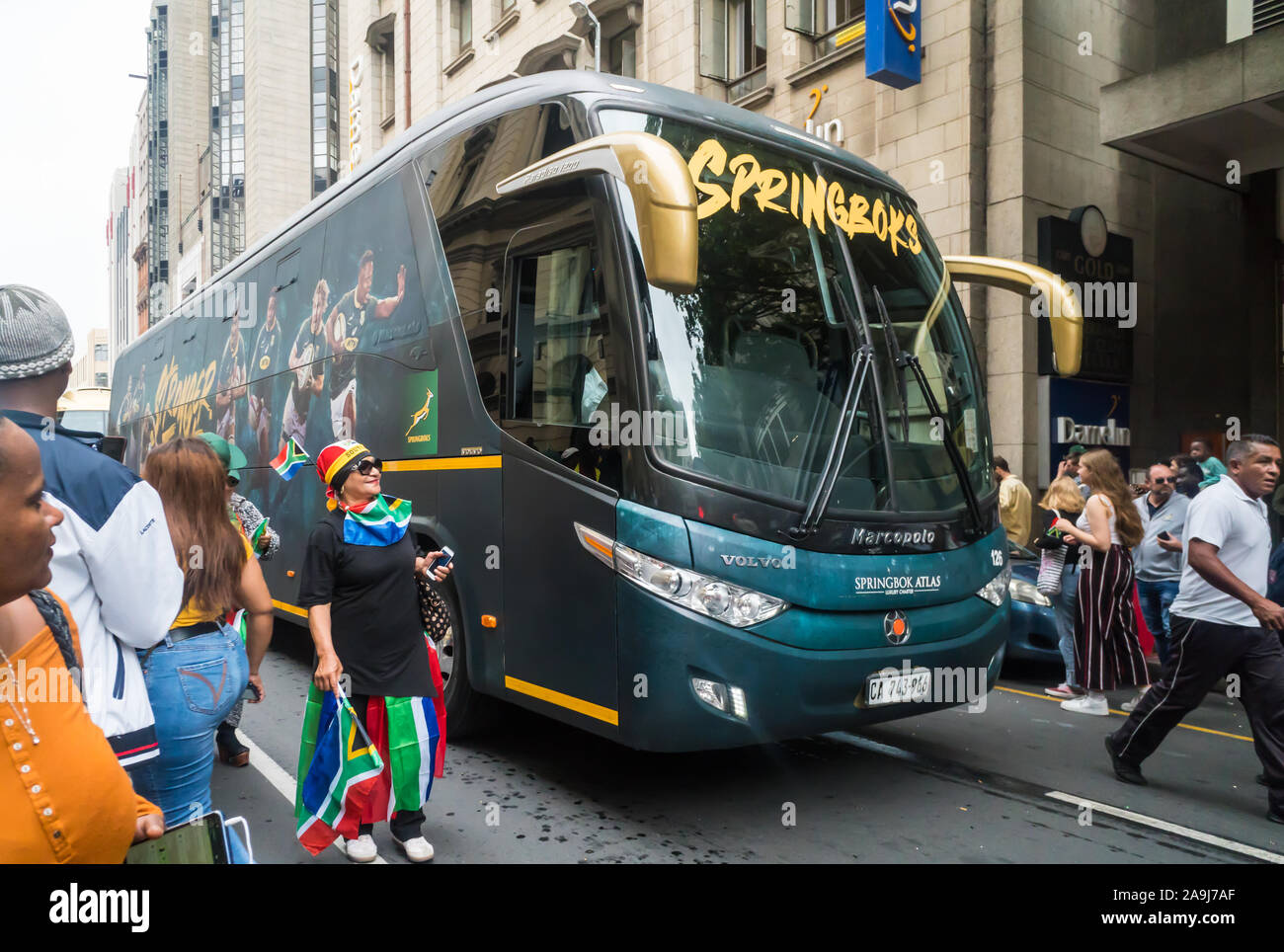 South African Springbok rugby team luxury touring bus drives through city streets of Cape Town during a celebration event as world cup winners 2019 Stock Photo