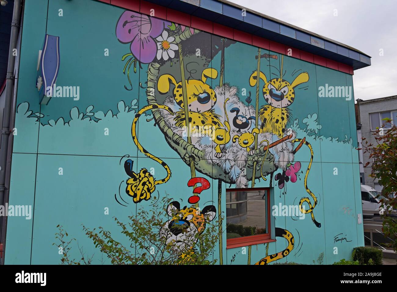 A large mural of Belgian cartoon comic book character Marsupilami from  Le nid des Marsupilamis on the wall of a police station in Brussels, Belgium Stock Photo