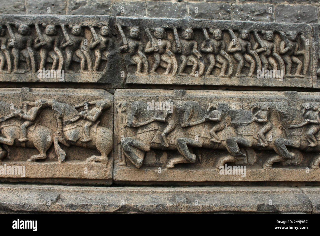 Carved sculpture of warriors and horses. Aundha Nagnath Temple, Hingoli, Maharashtra, India. Eighth of the twelve jyotirlingas in India Stock Photo